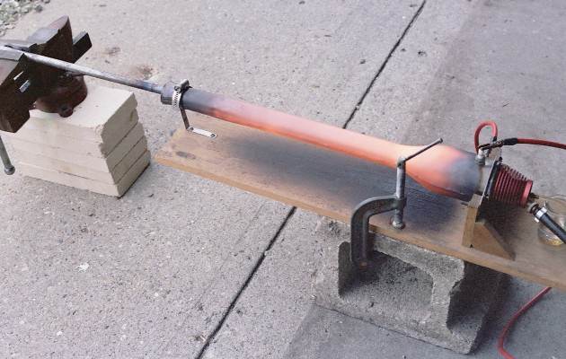 Basic test setup - vise holding sample tube in DynaJet tailpipe - photo by Larry Cottrill